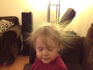 She wasn't swishing her hair.  It was sticking straight out after an encounter with the sofa.